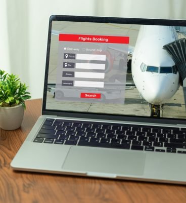 search Online booking plane ticket vacation on laptop. booking flight travel holidays online. search Online booking plane ticket vacation on laptop. booking flight travel holidays online.
